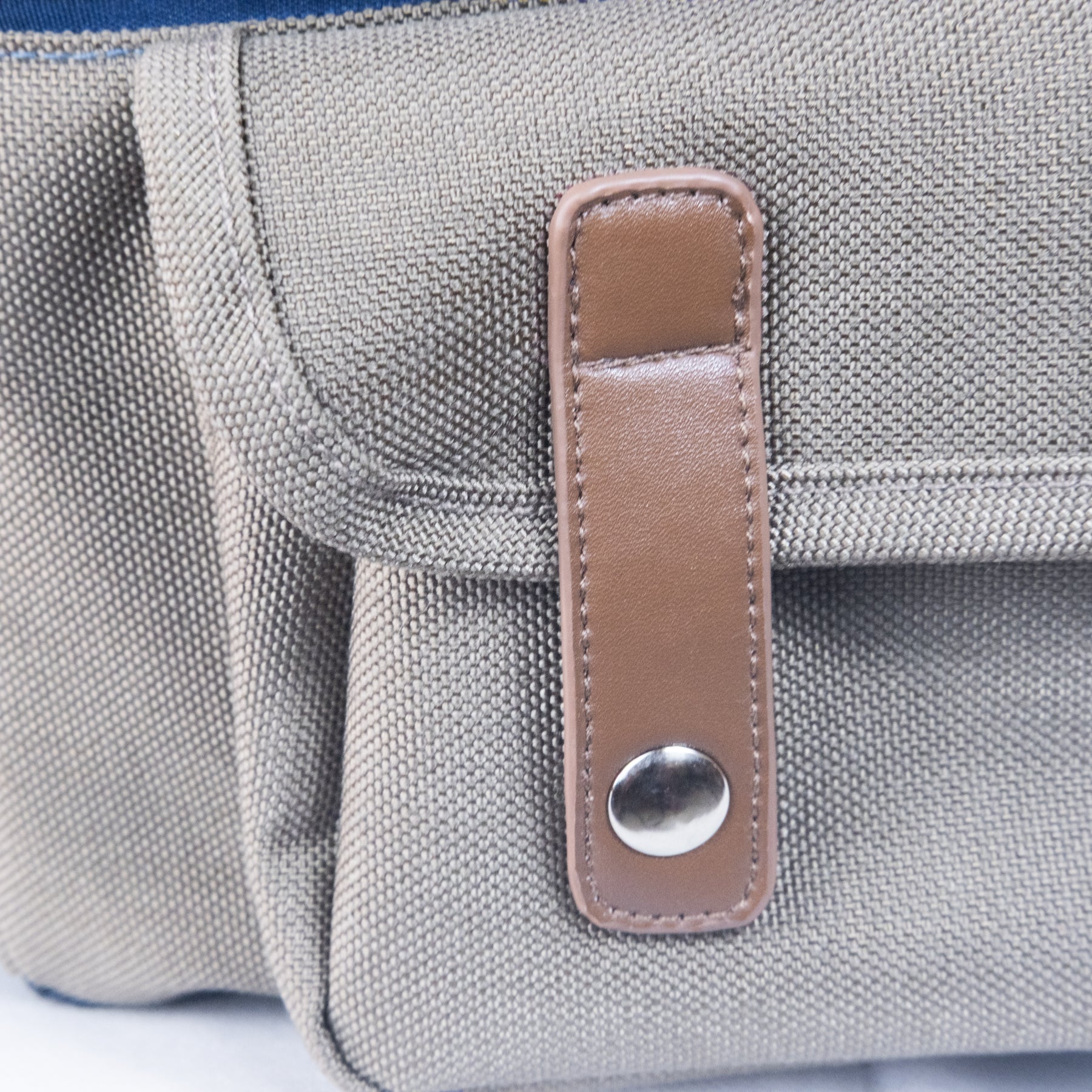 Leather snap pouch on dog backpack, stylish storage feature for outdoor gear